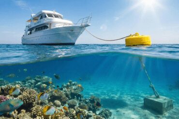 Diving boat tied to a HEPCA mooring buoy in the Red Sea to protect the coral reefs from anchor damage.