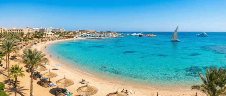 A stunning panoramic view of the Red Sea beach and resorts in Hurghada, Egypt, Illustrating the essential travel guide for tourists.