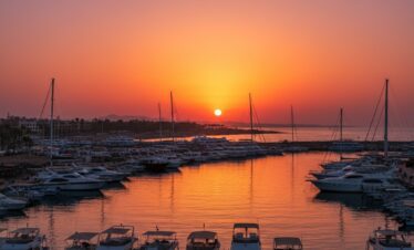 Boat returning to Hurghada marina at sunset